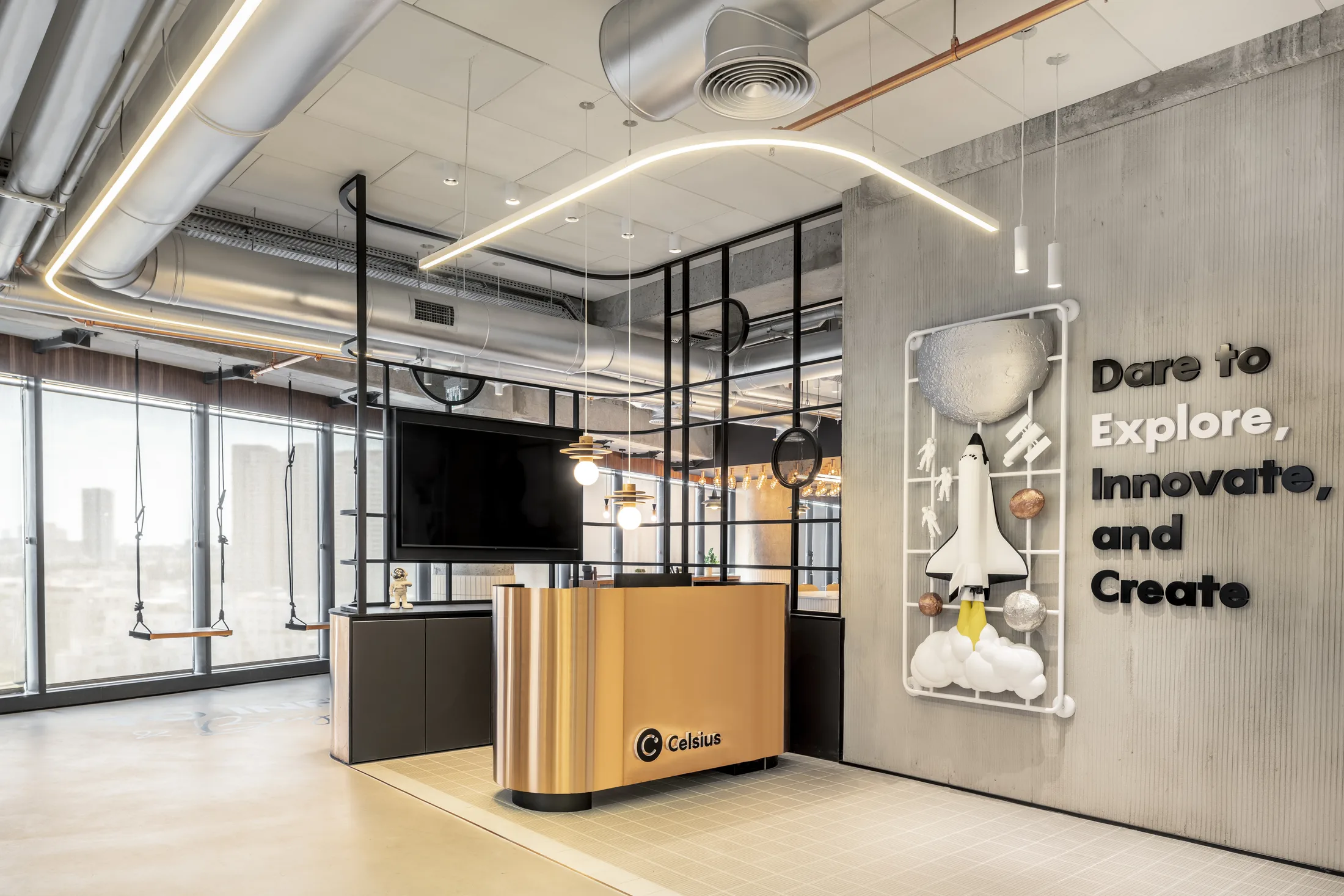 A reception area with a curving linear light line and an inspiration wall
