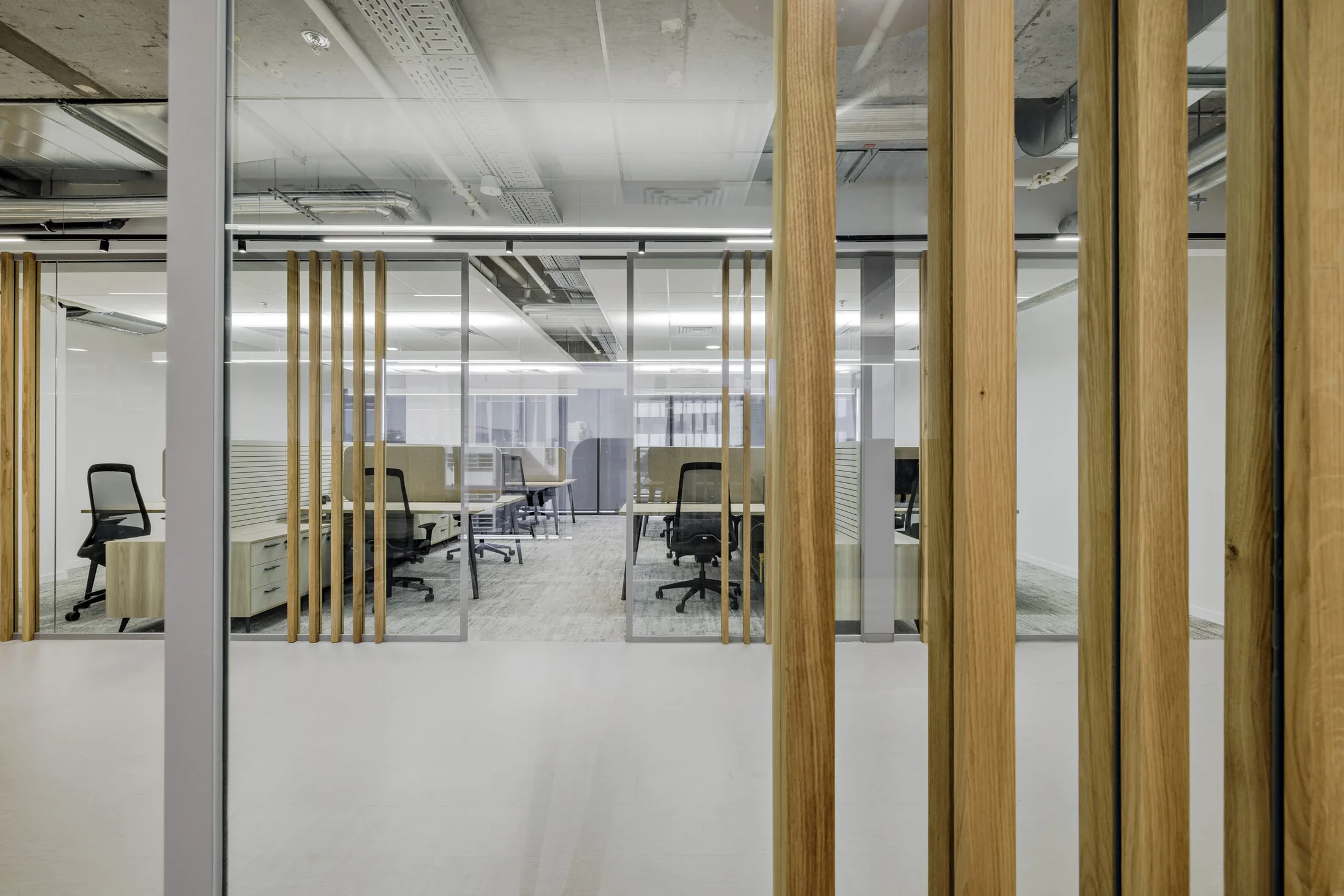 Glass and wood partitions at IT company offices