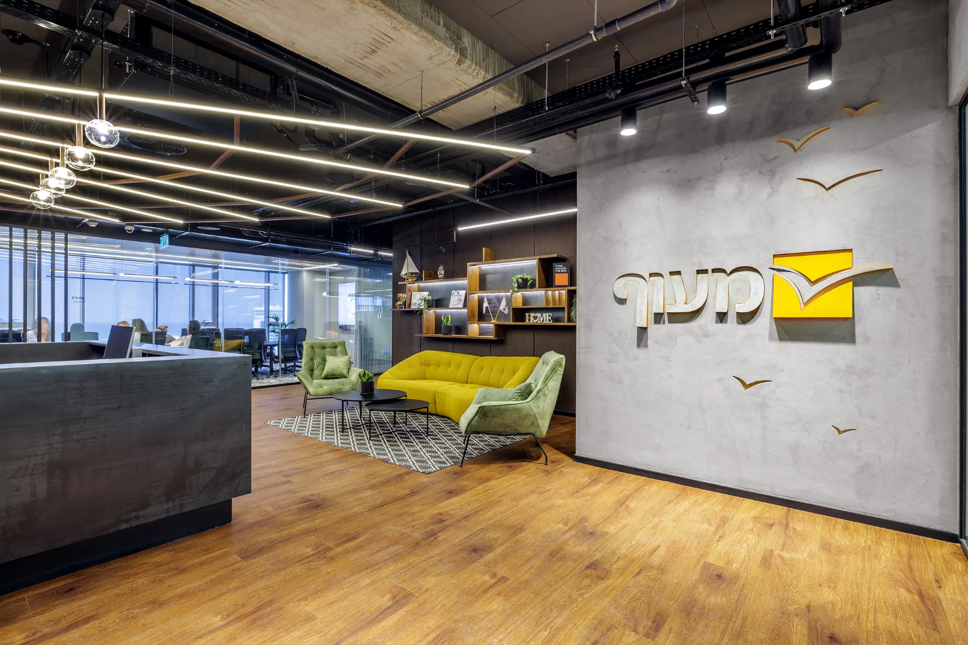 Breakout room with a glazed partition and an accent chair