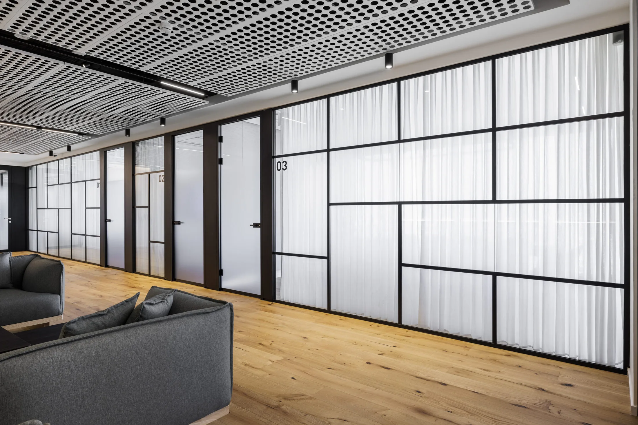 Seating and glass partition area at Meitav offices