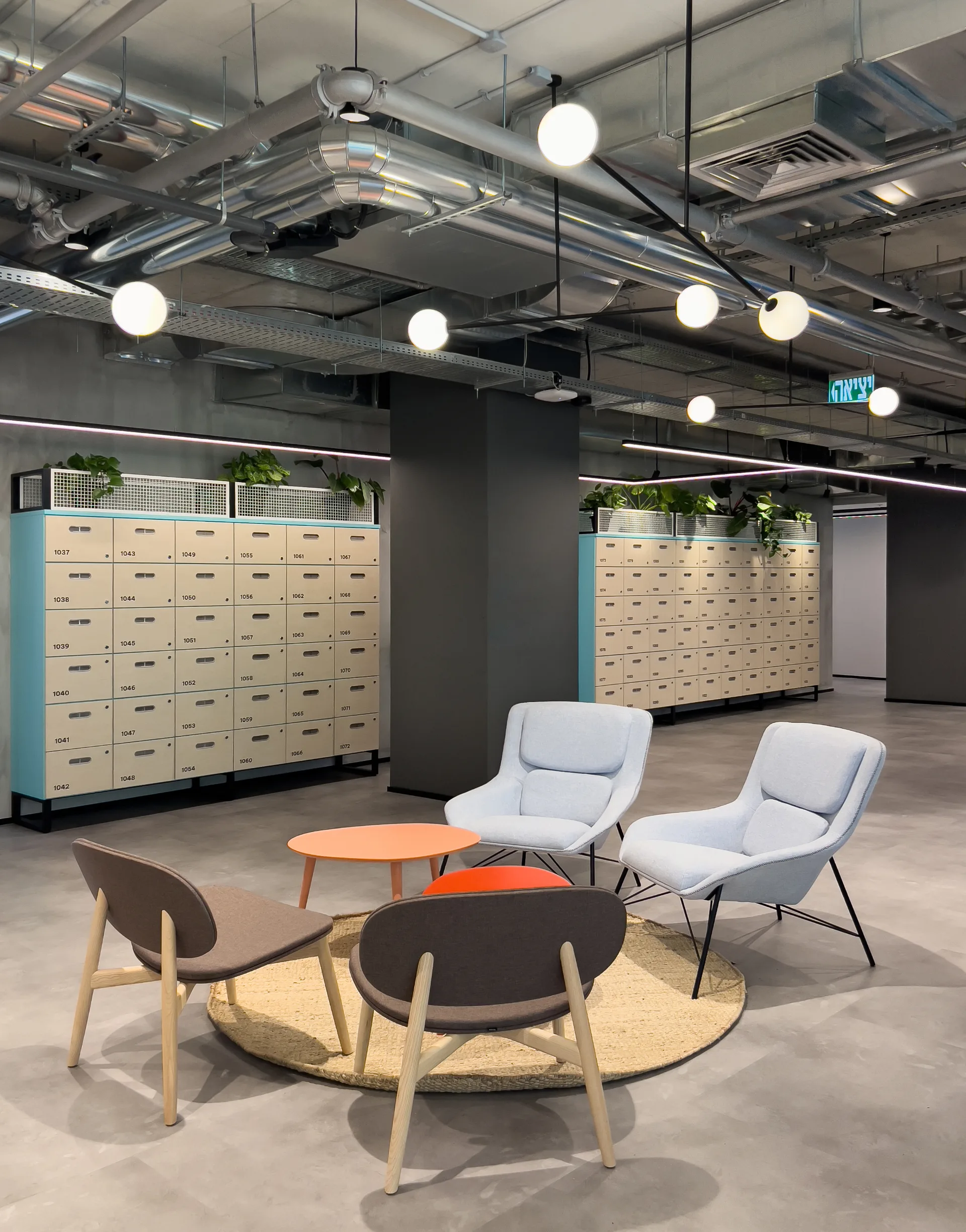 Lounge beside a locker wall with globe lights