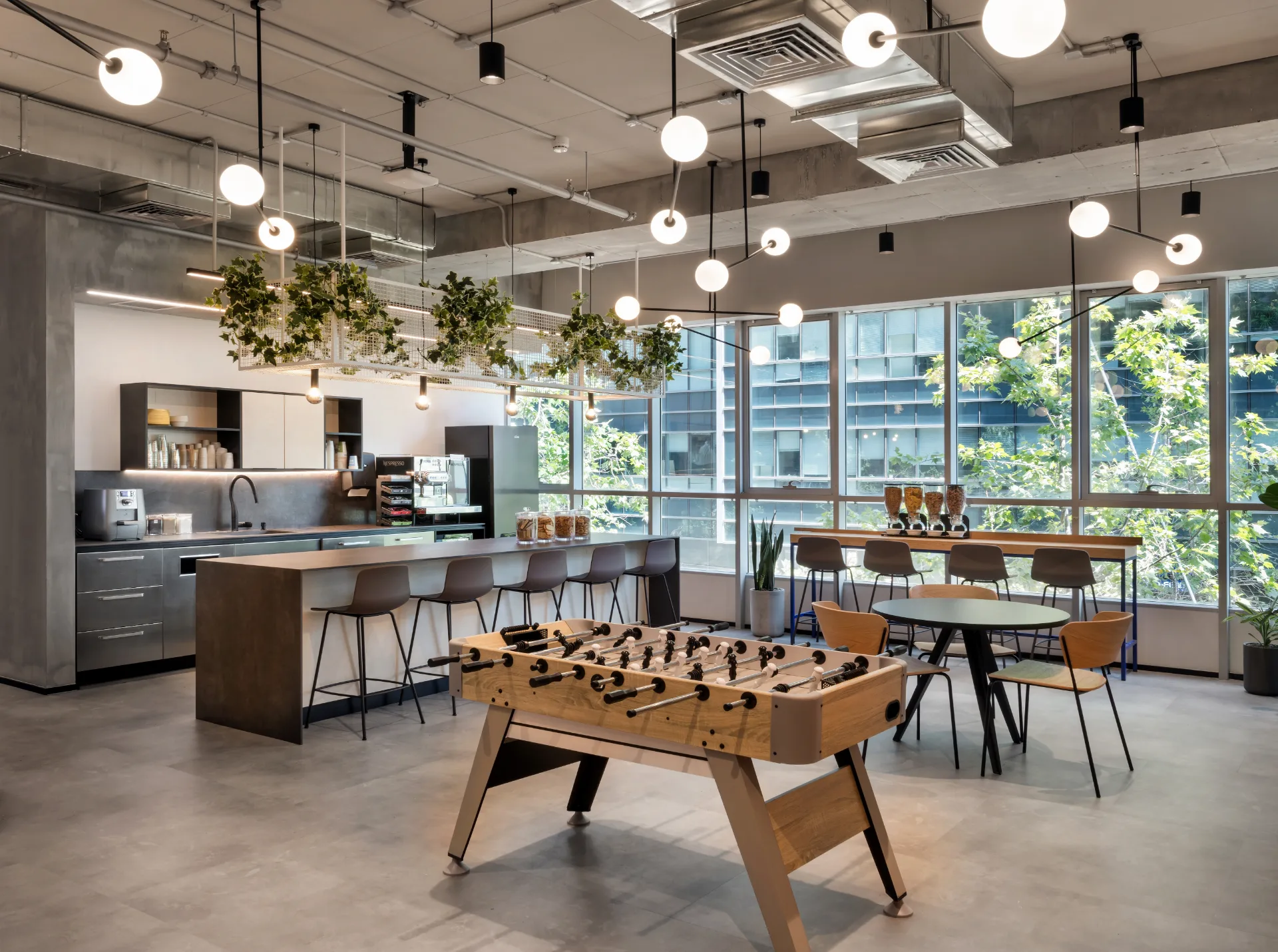 Kitchen and social hub with glass-globe clusters