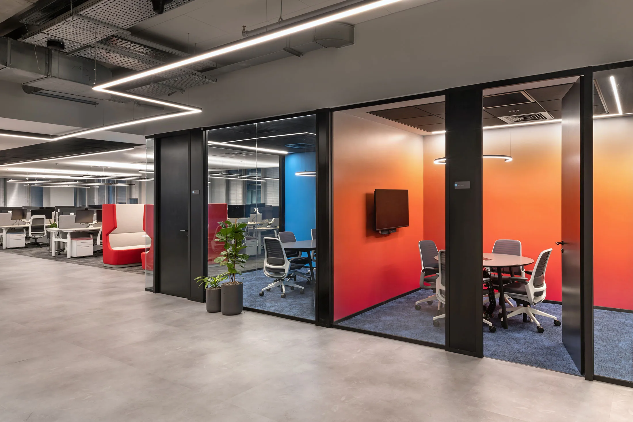 Colorful meeting rooms at NICE offices