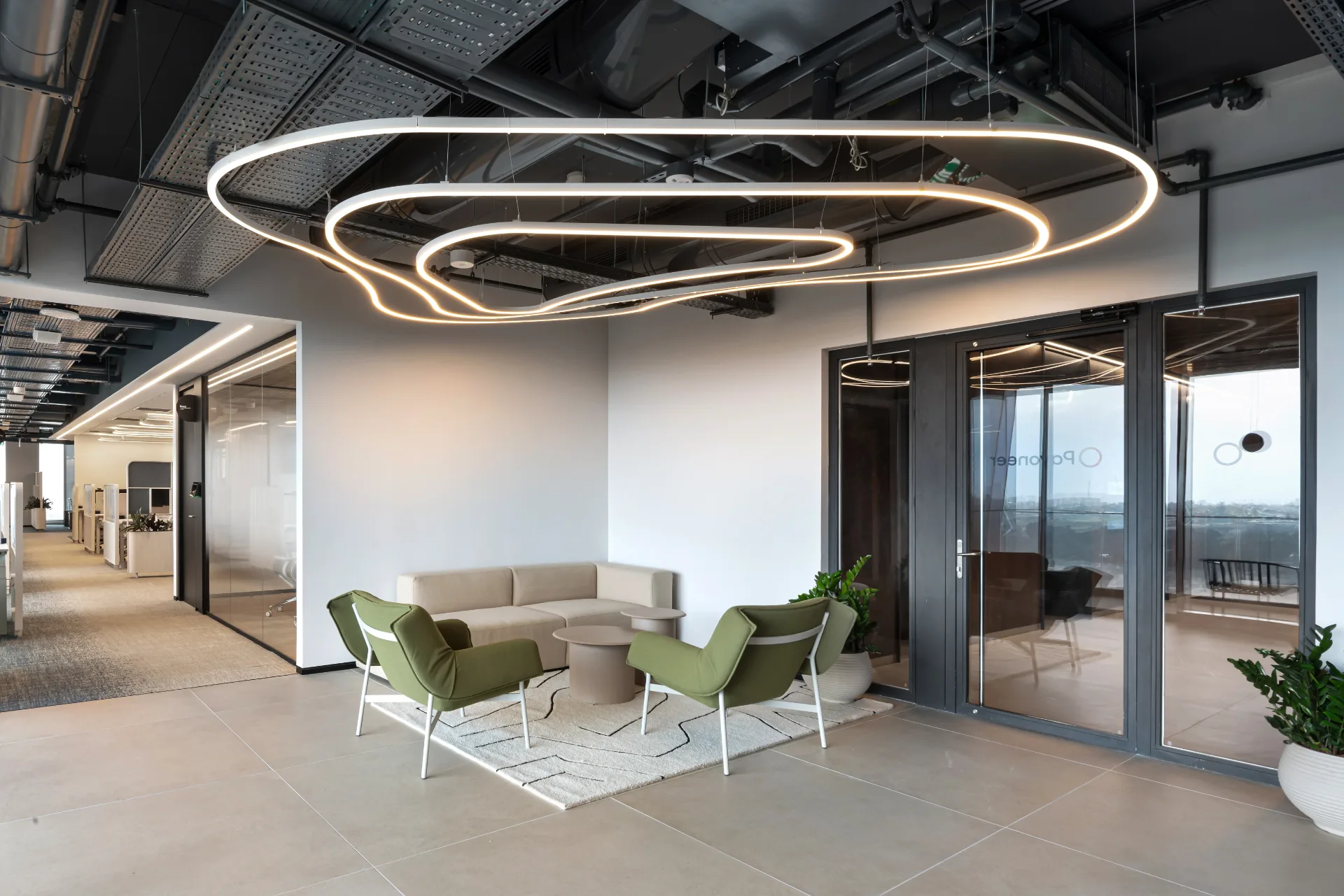 Lounge with an elliptical ring chandelier