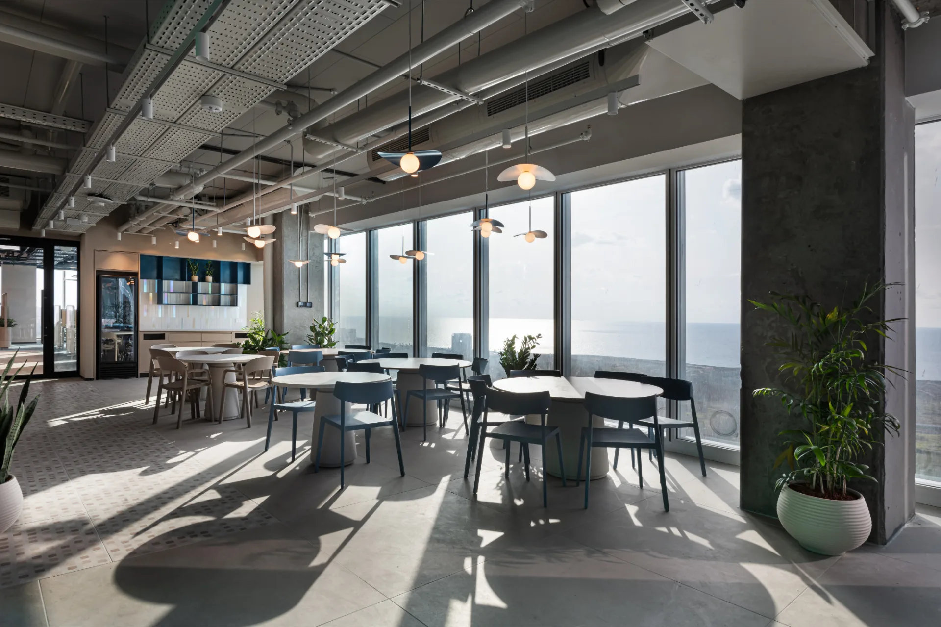 Dining area facing a panoramic sea view